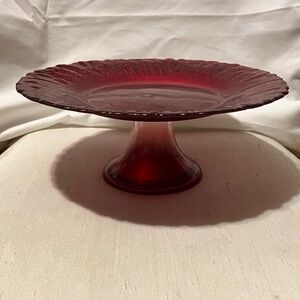 Red sparkle glass 8” circular pie -cake dish.  Stands 3” high , ruffle like edge